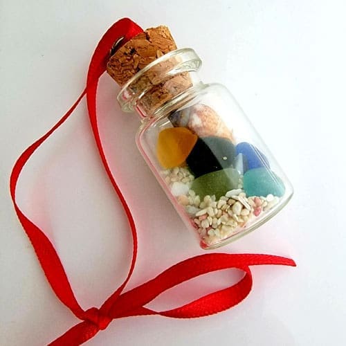 sand, sea glass and shells in a bottle Christmas Ornament
